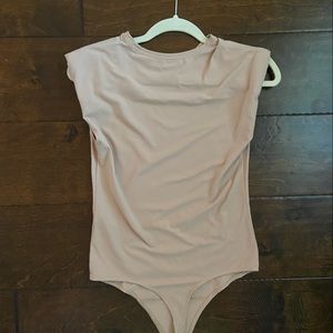 Tan body suit. Size medium.
